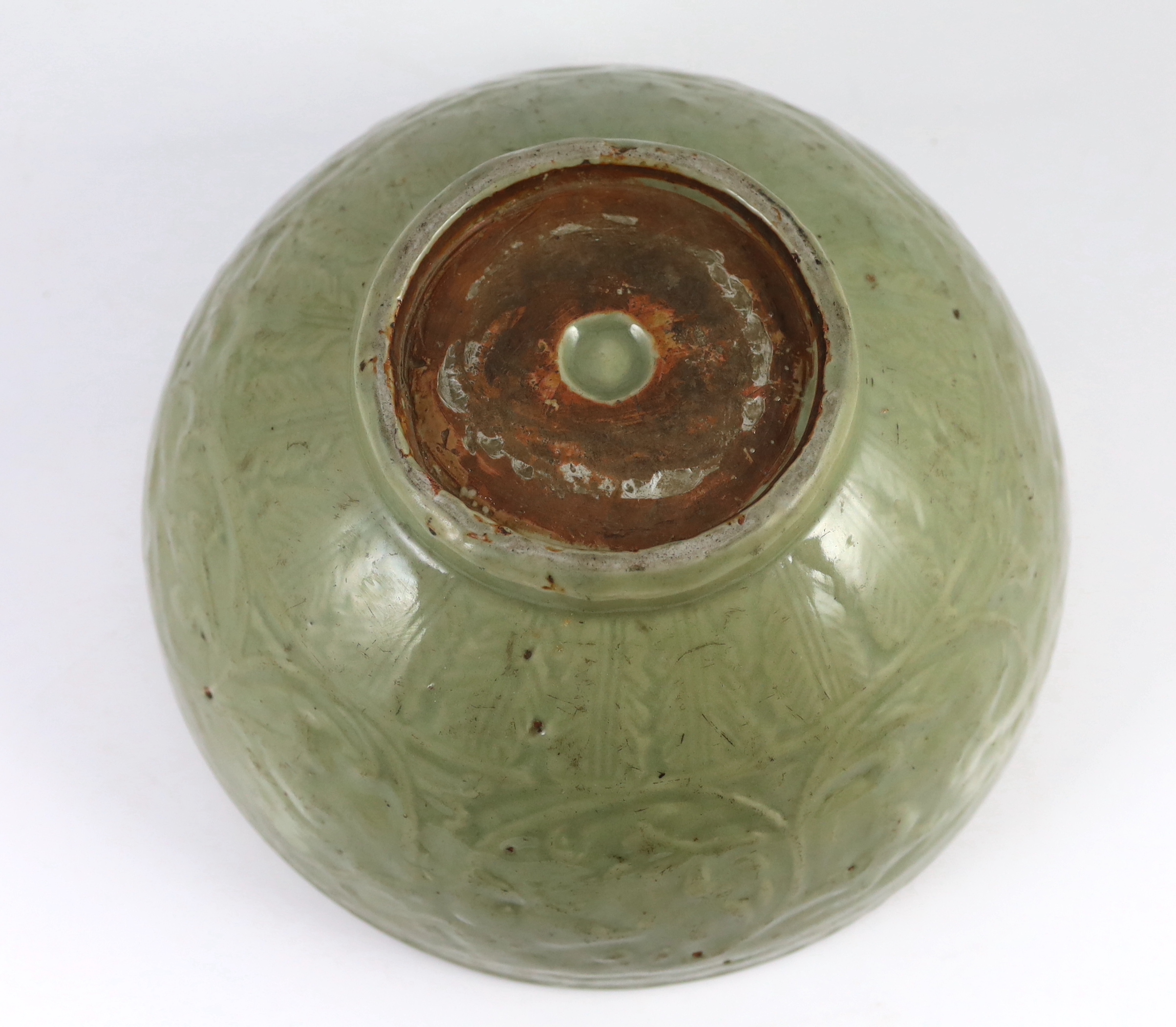 A large Chinese Ming carved Longquan celadon deep bowl, first half 15th century, scratches to glaze